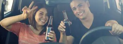 Conduite en état d'ivresse : et l'assurance auto ? alcool-couple-voiture